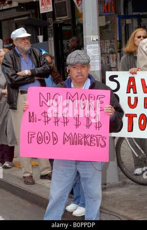Residents of the New York neighborhood of Chelsea rally on Ninth Avenue to support small businesses Stock Photo
