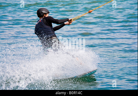 Man cable water skiing or waterboarding Stock Photo - Alamy