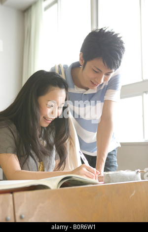 Students reading together Stock Photo