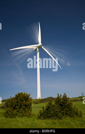 A windmill at work on the 'du Coiron' plateau (Ardeche - France). Eolienne en mouvement sur le plateau du Coiron (France). Stock Photo