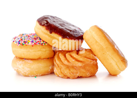 Pile of assorted donuts isolated on white background Stock Photo