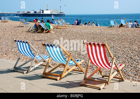 Deckchairs on Brighton beach, UK Stock Photo