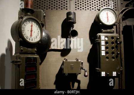 An old-fashioned industrial control panel equipped with vintage analog instrumentation Stock Photo