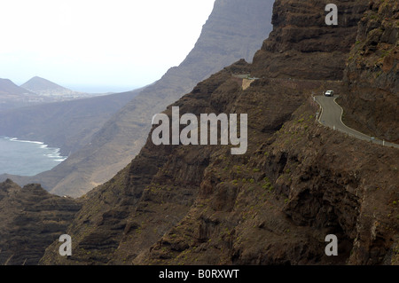 Gran Canaria coastal road that winds through the rugged volcanic mountain slopes from San Nicolas de Tolentino to Agaete Stock Photo
