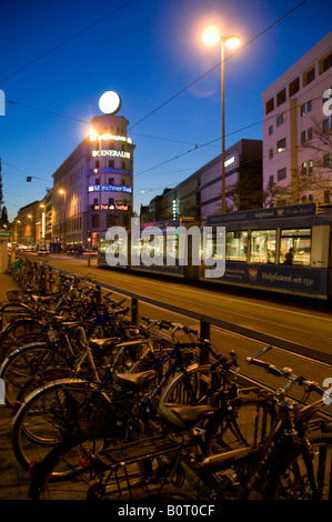 Tram running at night through the city of Munich capital of Bavaria Germany Stock Photo