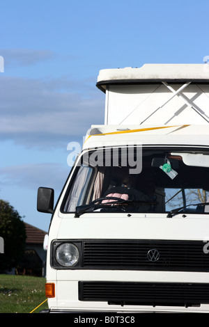 classic VW campervan parked in Irish campsite Stock Photo