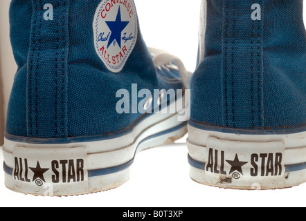 Pair of Converse Basketball Boots in worn condition, Converse is an American shoe company founded in 1908 Stock Photo