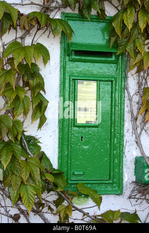 quaint old Irish post box in wall in County Mayo, Ireland Stock Photo