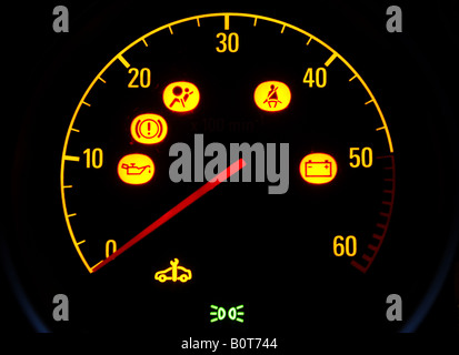 CAR REV COUNTER WITH ILLUMINATED WARNING SYMBOLS,UK. Stock Photo