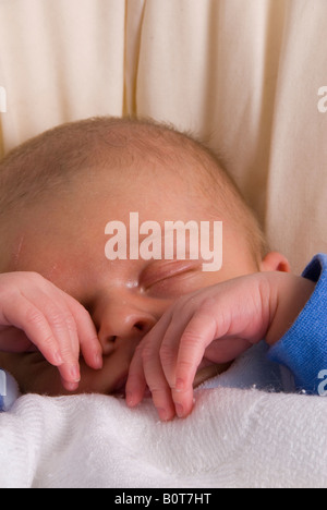 Close Up on Hands and Face of Sleeping Newborn Baby Boy Joshua Kailas Hudson Aged 20 days Stock Photo