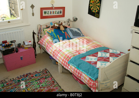 Child's bedroom with William sign at head of bed. Young teenage boy's tidy bedroom. Stock Photo