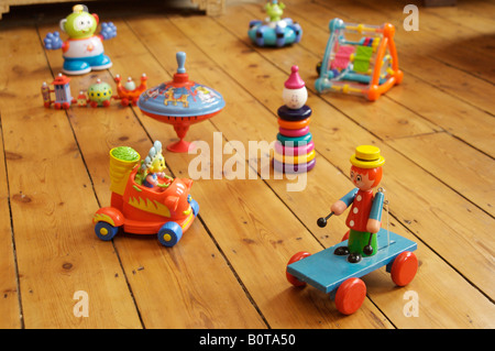 Children's toys on wooden floor Stock Photo