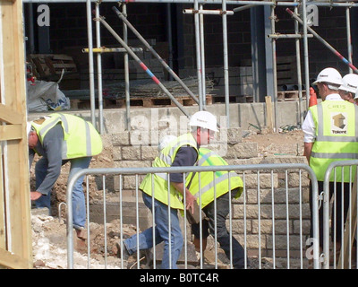 Bricklayers on building site, in North Bay development, Scarborough, England. Stock Photo