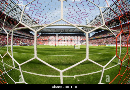 empty goal in filled football Stadium before kick-off Stock Photo