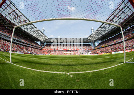 empty goal in filled football Stadium before kick-off Stock Photo