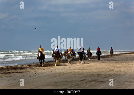 Horse riding on beach Corpus Texas Gulf of Mexico Stock Photo