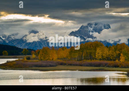 Aspen trees and fall storm clouds over Mount Moran at Oxbow Bend Snake River Grand Teton National Park Wyoming Stock Photo