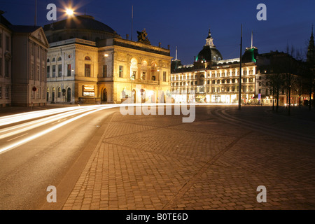 Charlottenburg (far left) and Kongelige Teater or Royal Theatre, Kongens Nytorv, Copenhagen, Denmark, at dusk. Stock Photo