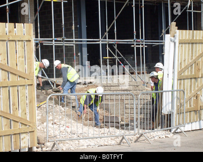 Bricklayers on building site, in North Bay development, Scarborough, England. Stock Photo