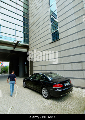 Clean energy hydrogen powered BMW 7 series luxury car parked in front of the European Union Parliament building Stock Photo