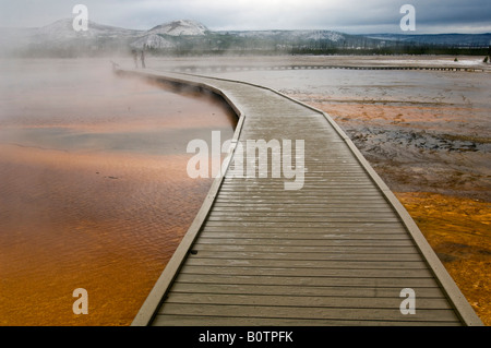 Tourist boardwalk and steam at the Grand Prismatic Spring Midway Geyser Basin Yellowstone National Park Wyoming Stock Photo