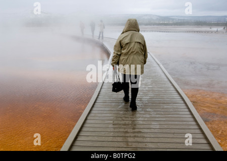 Tourist boardwalk and steam at the Grand Prismatic Spring Midway Geyser Basin Yellowstone National Park Wyoming Stock Photo