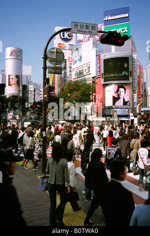 People cross what is reportedly the world's busiest scramble crossing in central Tokyo's Shibuya in Japan. Stock Photo