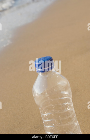 empty plastic bottle on the shoreline Stock Photo