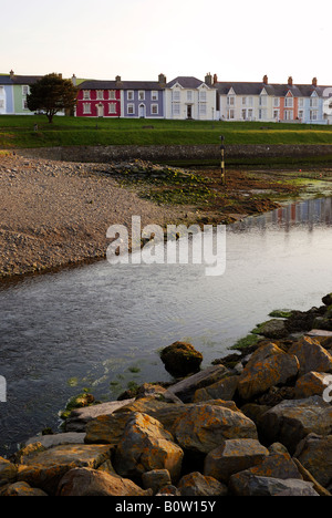 STREET OF BRIGHTLY PAINTED HOUSES OVERLOOKING THE RIVER AERON AT DUSK IN THE SEASIDE TOWN OF ABERAERON CEREDIGION WALES Stock Photo