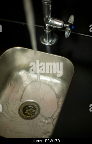 Stainless steel laboratory sink with running water