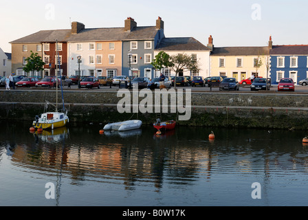 STREET OF BRIGHTLY PAINTED HOUSES AT DUSK OVERLOOKING THE HARBOUR IN THE SEASIDE TOWN OF ABERAERON CEREDIGION WALES Stock Photo