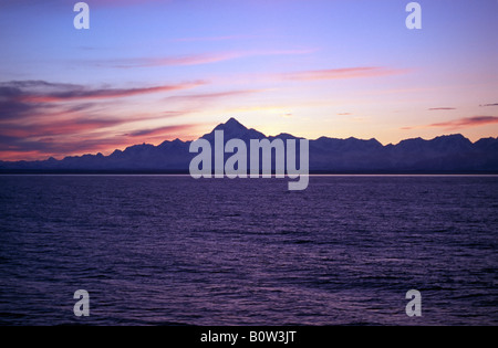 After sunset shot of mountains in Alaska taken from a boat Stock Photo