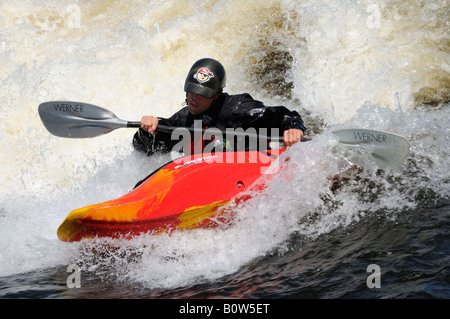 Young Man Kayaking In White Water Rapids Stock Photo