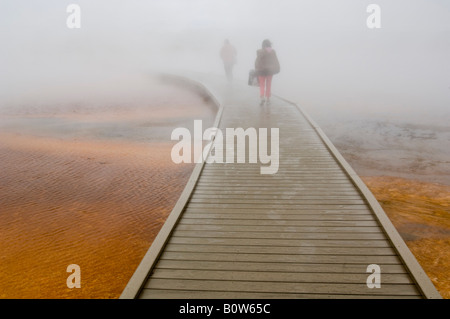 Tourist boardwalk and steam at the Grand Prismatic Spring Midway Geyser Basin Yellowstone National Park Wyoming Stock Photo