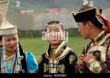 Two women and a man wearing traditional Mongolian national costumes, Ulan Bator or Ulaanbaatar, Mongolia, Asia Stock Photo