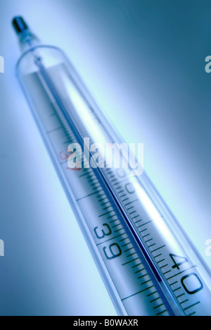 Thermometer against a blue backdrop