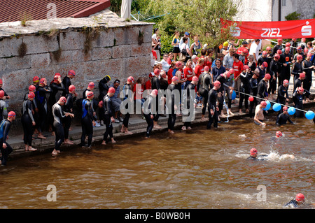 Triathlon swimmers gather at the race start, Kallmuenz, Oberpfalz, Upper Palatinate, Bavaria, Germany, Europe Stock Photo
