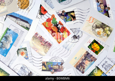 Assorted stamps, clipped from envelopes Stock Photo
