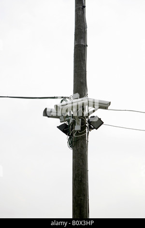 Three Security Cameras posted on a utility pole Stock Photo