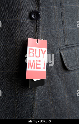 ‘Buy Me!’ price tag hanging from a sport jacket button Stock Photo