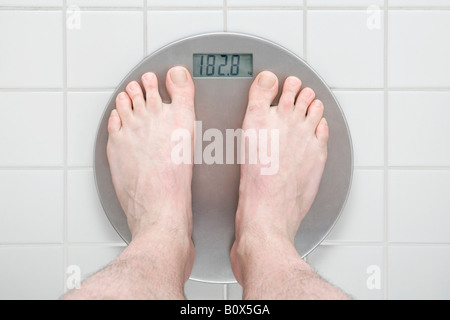 Human Foot On Weighing Scale Stock Photo - Alamy