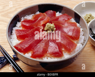 Steamed rice topped with tuna sashimi Stock Photo