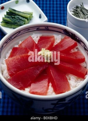 Steamed rice topped with tuna sashimi Stock Photo