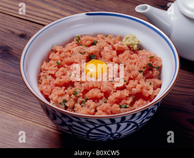 Steamed rice topped with chopped tuna sashimi and spring onion Stock Photo