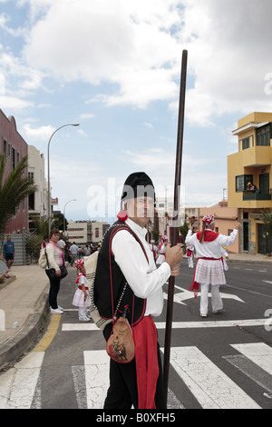 Man in traditional goatherd costume with pole in the Romeria de San Isidro, Guia de Isora, Tenerife Stock Photo
