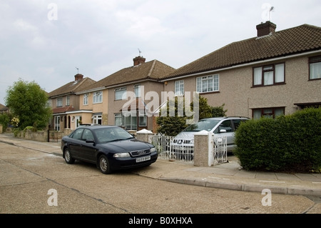 Row of residential street and semi-detached houses of 40s, 50s architecture, Collier Row, Romford, Essex, UK, GB, England, EU Stock Photo