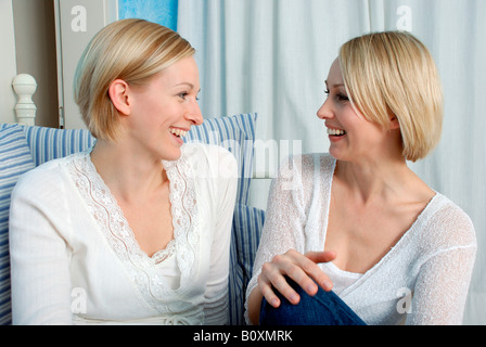 Two blonde women, laughing, portrait Stock Photo