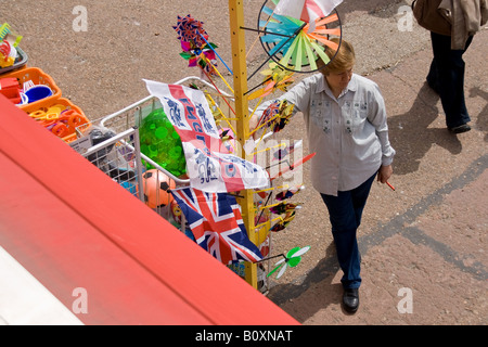 woman outside beach shop on brighton beach Stock Photo