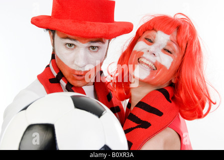 Austrian and Swiss soccer fans, EURO 2008. A man and a woman with football Stock Photo