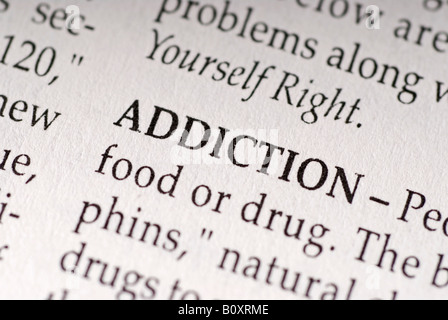 Stock photo the word addiction as it appears in the dictionary. Stock Photo